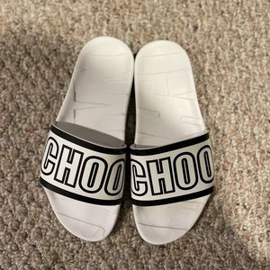 Jimmy Choo slides for a fashionable addition to your vacation or lounging.